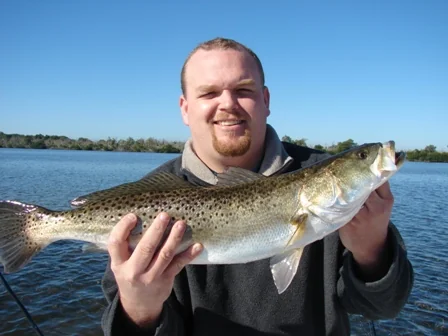 An angler with a speckled trout